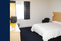 /imageLibrary/Images/79018 GLA Travelodge room.png